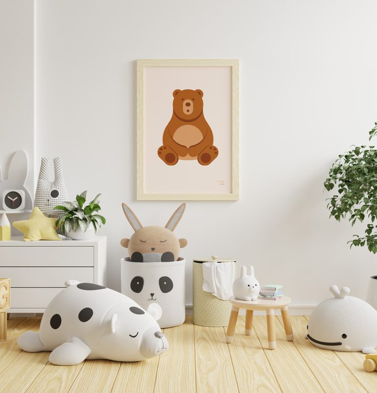 General shot of a child's room with various toys and a of a minimalist-style poster of a bear hanging on the wall.