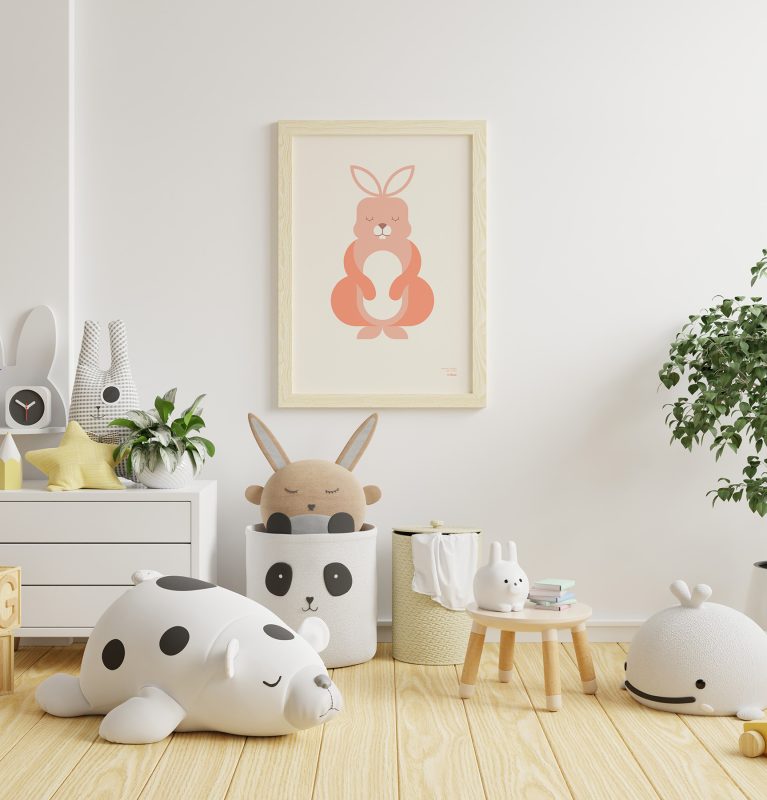 General shot of a child's room with various toys and a of a minimalist-style poster of a rabbit hanging on the wall.